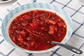 Russian and ukrainian national food - red beet soup, borscht . Closeup