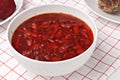 Russian and ukrainian national food - red beet soup, borscht . Closeup