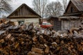 Chopped firewood stacked in one big pile for kindling and heating the Russian hut in the winter season. Royalty Free Stock Photo