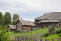 Russian village in summer. Country yard with old log houses Royalty Free Stock Photo