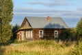 Old log house with a courtyard overgrown with grass. Village of Visim, Sverdlovsk region, Russia Royalty Free Stock Photo