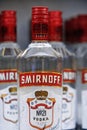 Russian vodka. Bottles of Smirnoff vodka on a shelf in duty free shop in Dubai Airport. Traditional Russian souvenir. 12 Royalty Free Stock Photo