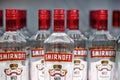 Russian vodka. Bottles of Smirnoff vodka on a shelf in duty free shop in Dubai Airport. Traditional Russian souvenir. 12 Royalty Free Stock Photo