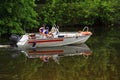 Russian water rescuers Ministry of Emergency Situations patrol on a boat in the summer river.