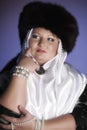 Russian woman in a fur hat, white scarf and with pearls Royalty Free Stock Photo