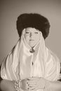 Russian woman in a fur hat, white scarf and with pearls Royalty Free Stock Photo