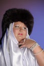 Russian woman in a fur hat, white scarf and with pearls Royalty Free Stock Photo