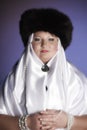 Russian woman in a fur hat, white scarf and with pearls Royalty Free Stock Photo