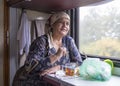 Russian woman having a meal in the train,russian federation