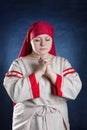 Russian woman praying in national clothes