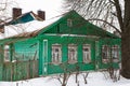 A Russian wood house covered in snow Royalty Free Stock Photo