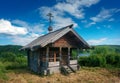 Russian wooden chapel in the forest