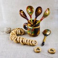 Russian wooden painted tableware: spoons in a mug Royalty Free Stock Photo