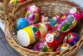 Russian wooden souvenir dolls matryoshka in a wicker basket Royalty Free Stock Photo