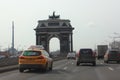 Russian yellow taxi car Citymobil in Moscow on Triumphal arch background