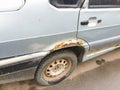 Rust on the car body, cosmetic car repair from rust, metal corrosion