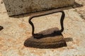 Rusty Clothes Iron on Concrete Surface Royalty Free Stock Photo
