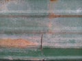 Rust on green metal sheet. Royalty Free Stock Photo