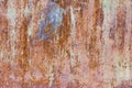 Rust, rusty metal wall, old metal sheet covered with paint, rust and scratches Royalty Free Stock Photo