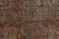 Rust on a sea door showing seams