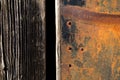 Rust texture. Grunge rusted metal, nails and older wood plank, rust and oxidised metal background. Old metal iron panel. Royalty Free Stock Photo