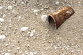 Rust tin can on the beach. Garbage on the beach. Marine pollution Royalty Free Stock Photo