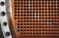 Rust tube sheet of the heat exchanger for maintenance, the water heater in the boiler as background