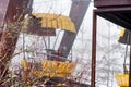 Rust yellow ferris wheel attraction in fog in winter abandoned amusement park Chernobyl zone of alienation