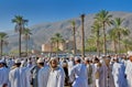 Rustaq old town in Friday market souq, Rustaq fort behind the crowds & date palms trees