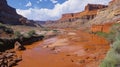 A rustcolored river its banks eroded and jagged a manifestation of the corrosive effects of acid rain on the earths