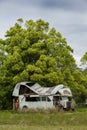 Rusted and abandoned bus or truck with severe roof damage Royalty Free Stock Photo