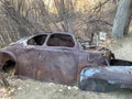 Rusted Abaondoned Car on Trail in High Desert