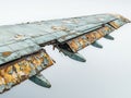 Rusted airplane sitting on the ground in an abandoned location with weathered surface and worn-out features Royalty Free Stock Photo