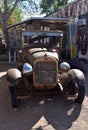 Rusted Antique Car in the Sun Outside of Hackberry General Store Royalty Free Stock Photo