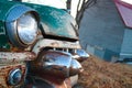 Rusted antique green car headlight