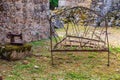 Rusted bed frame and sewing machine in the ruins of the martyr village of Oradour-sur-Glane Royalty Free Stock Photo