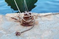 Rusted bollard holding boats in Greece harbor Royalty Free Stock Photo