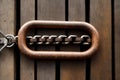 A rusted chain hanging from an old wooden dock