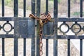 Rusted chain with a lock on the old iron gate Royalty Free Stock Photo