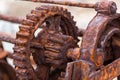 The rusted cogs and gears of a historic boat winch used on the F