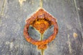 Rusted door knocker in the hill town or Erice