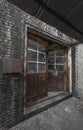 Rusted doors and bricks of an abandoned factory