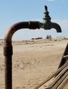 A rusted and dry tap at the ruins of an old mining settlement