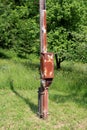 Rusted electrical box on old wooden utility pole Royalty Free Stock Photo