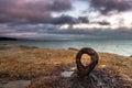 Rusted Eyebolt Looks Out to the Atlantic Ocean at Sunset Royalty Free Stock Photo