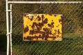 Rusted Fence Sign Royalty Free Stock Photo