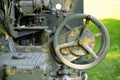 Rusted guidance wheel on decommissioned artillery cannon Royalty Free Stock Photo