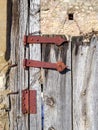 Detail of an antique aged wooden door of a European rural village Royalty Free Stock Photo
