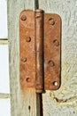 Rusted hinge an old wooden doors