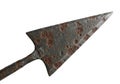 A rusted iron arrowhead is displayed against a white background. It features a distinct triangular Royalty Free Stock Photo